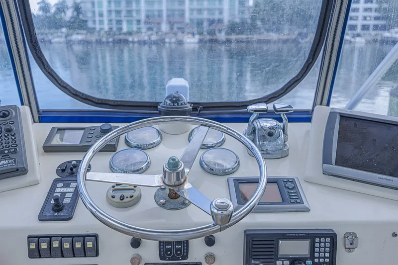 Slide: The Image of Helm of 1973 Hatteras 36 Sport Fisherman with navigation instruments and steering wheel. - 19