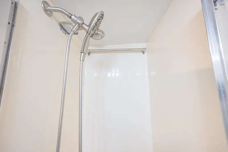 Slide: The Image of Shower area inside 1973 Hatteras 36 Sport Fisherman boat, featuring modern fixtures. - 35