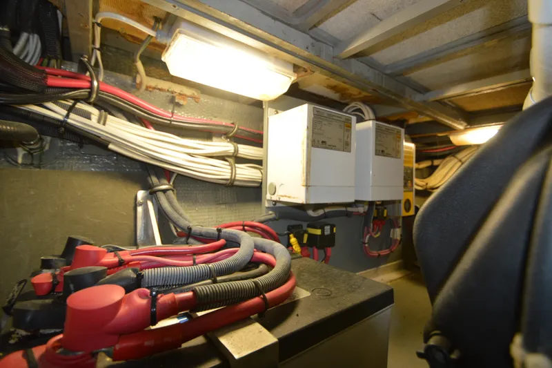 Slide: The Image of Electrical wiring and components inside a 1973 Hatteras 36 Sport Fisherman boat. - 42