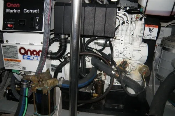 Slide: The Image of Engine room of a 1973 Hatteras 36 Sport Fisherman with Onan Marine Genset. - 45