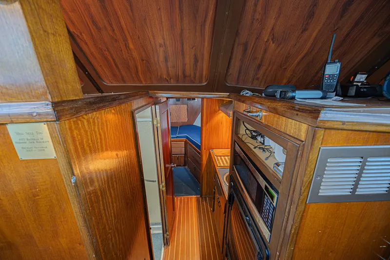 Slide: The Image of Interior of 1973 Hatteras 36 Sport Fisherman with wood paneling and modern equipment. - 27