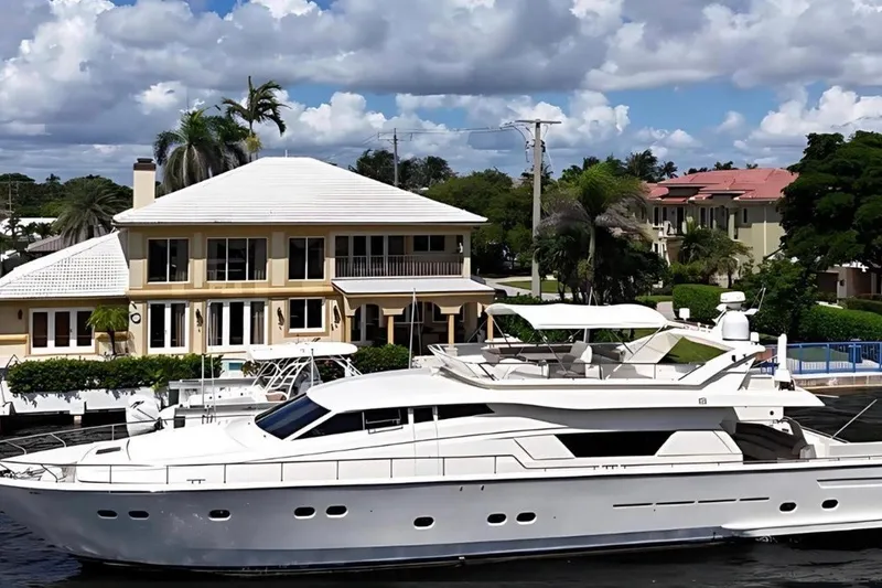 The Image of Luxurious 1998 Ferretti Yachts 80 FLY docked near waterfront mansion. - 0