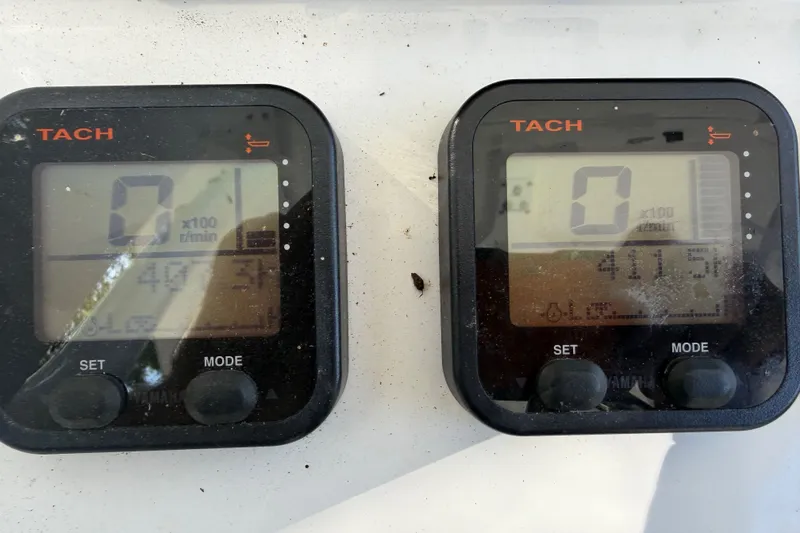 Slide: The Image of Close-up of tachometers on a 2013 Sea Hunt Gamefish 27 boat dashboard. - 8