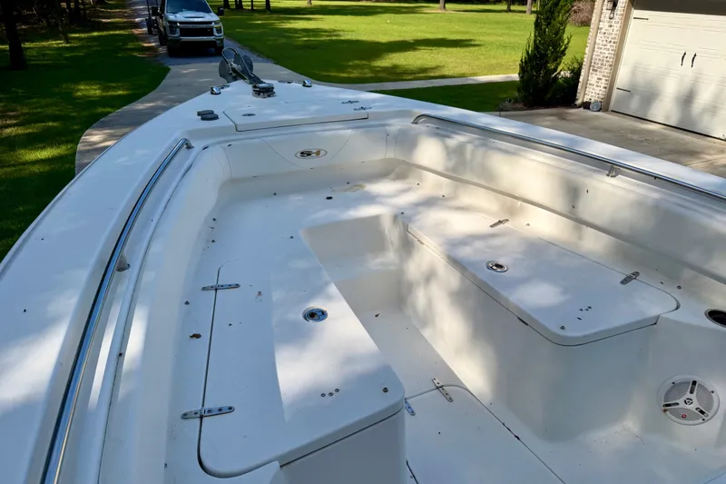 Slide: The Image of 2013 Sea Hunt Gamefish 27 boat interior, spacious deck with storage compartments. - 4