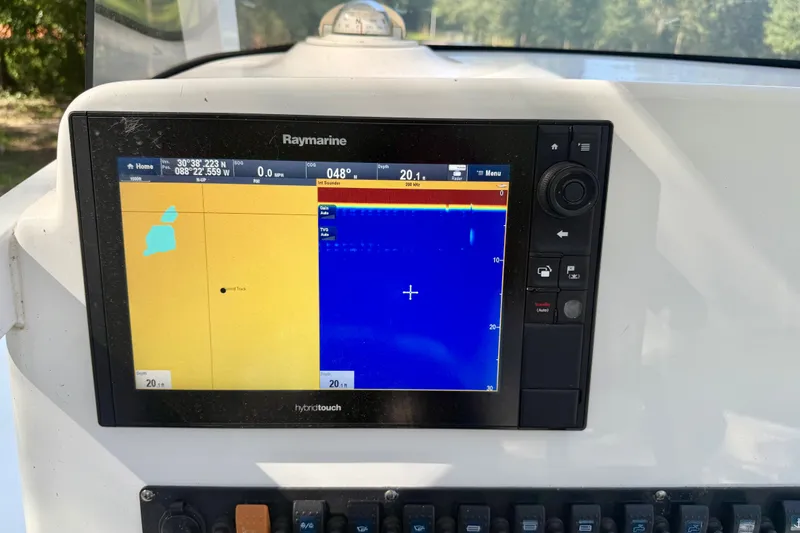 Slide: The Image of Raymarine navigation display on 2013 Sea Hunt Gamefish 27 boat dashboard. - 11