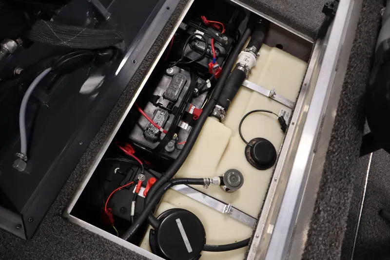 Slide: The Image of 2021 Lowe Stinger 195C boat battery and fuel system compartment. - 34