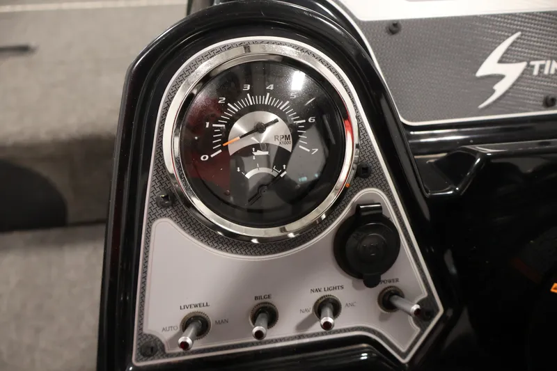 Slide: The Image of Dashboard of 2021 Lowe Stinger 195C boat with RPM gauge and control switches. - 22