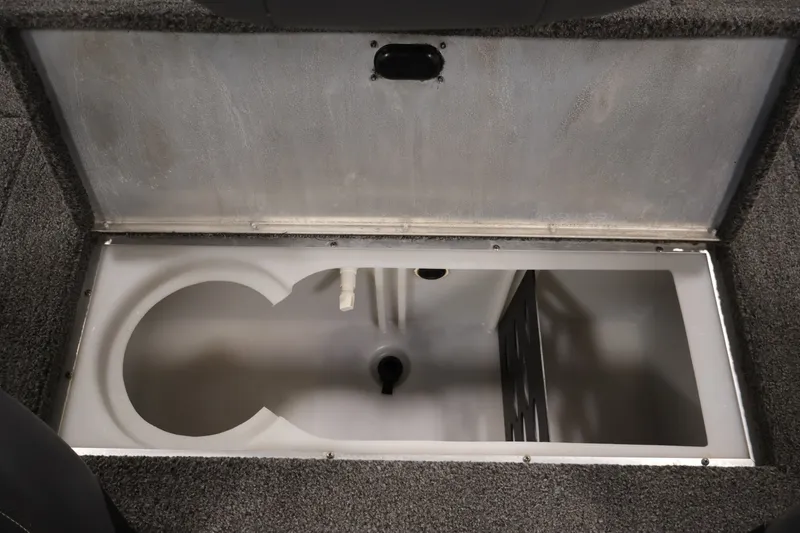 Slide: The Image of Open storage compartment in 2021 Lowe Stinger 195C boat, featuring a spacious interior. - 31