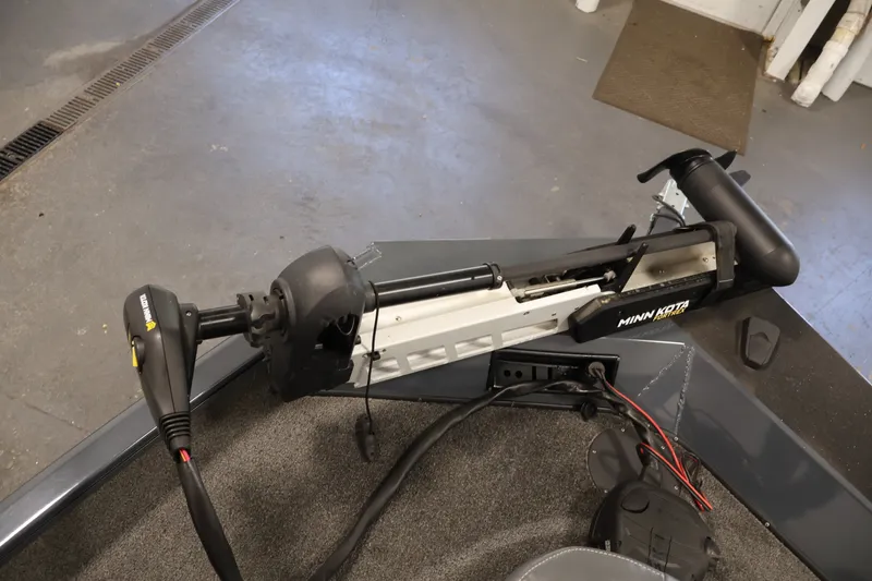 Slide: The Image of Minn Kota trolling motor on 2021 Lowe Stinger 195C boat, in a garage setting. - 10
