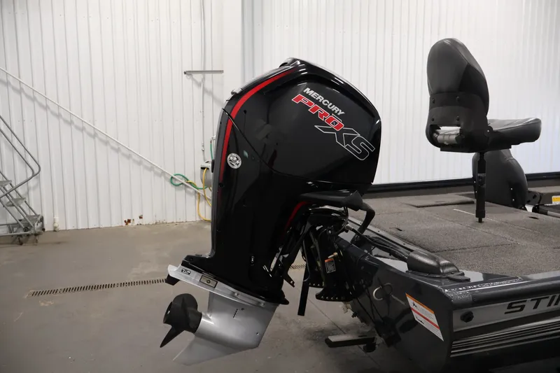 Slide: The Image of 2021 Lowe Stinger 195C boat with Mercury Pro XS outboard motor in a garage. - 35