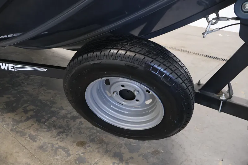 Slide: The Image of Trailer wheel of a 2021 Lowe Stinger 195C boat on concrete floor. - 40