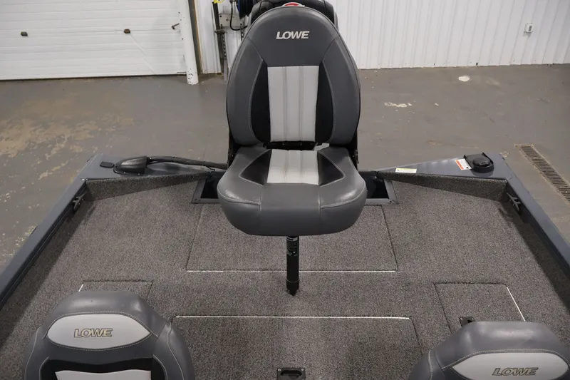 Slide: The Image of 2021 Lowe Stinger 195C boat interior with gray seating and carpeted deck. - 30