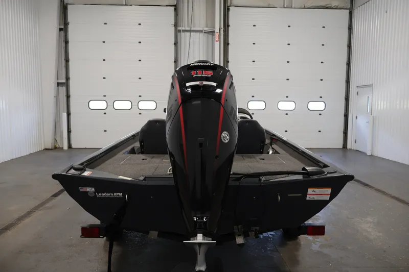 Slide: The Image of 2021 Lowe Stinger 195C boat with Mercury 115 outboard motor in a garage. - 5