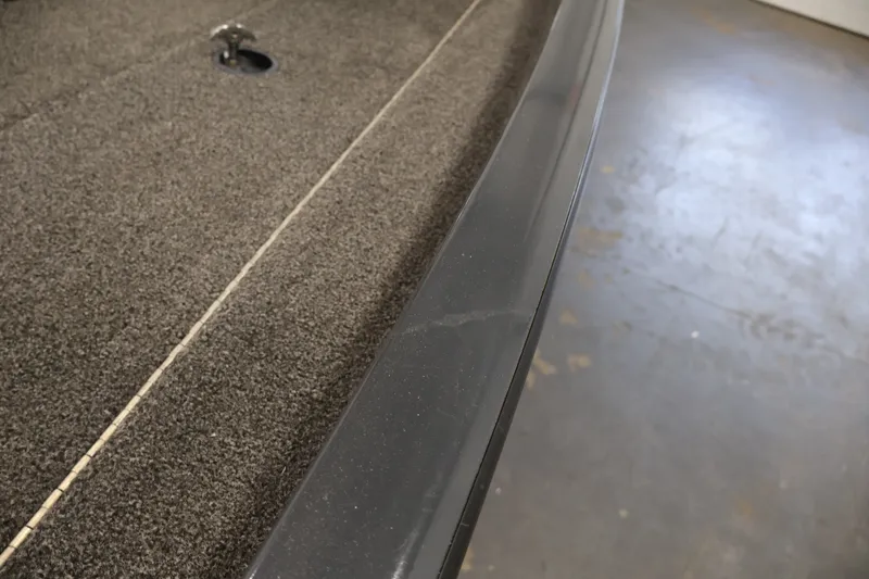 Slide: The Image of 2021 Lowe Stinger 195C boat interior with carpeted flooring detail. - 45