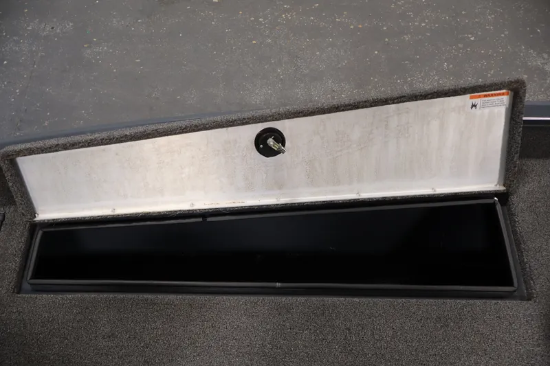 Slide: The Image of Open storage compartment in 2021 Lowe Stinger 195C boat. - 18