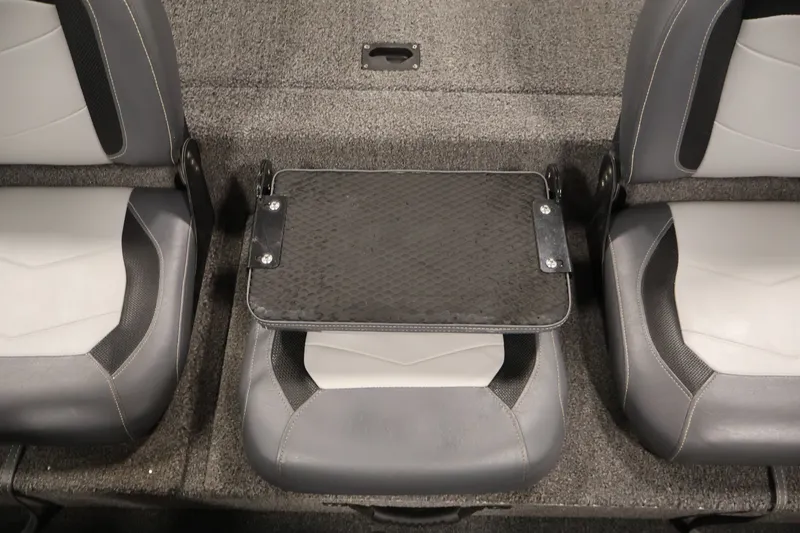 Slide: The Image of 2021 Lowe Stinger 195C boat interior with gray seats and a central foldable table. - 28
