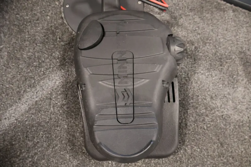 Slide: The Image of Foot pedal control on 2021 Lowe Stinger 195C boat, carpeted floor background. - 13