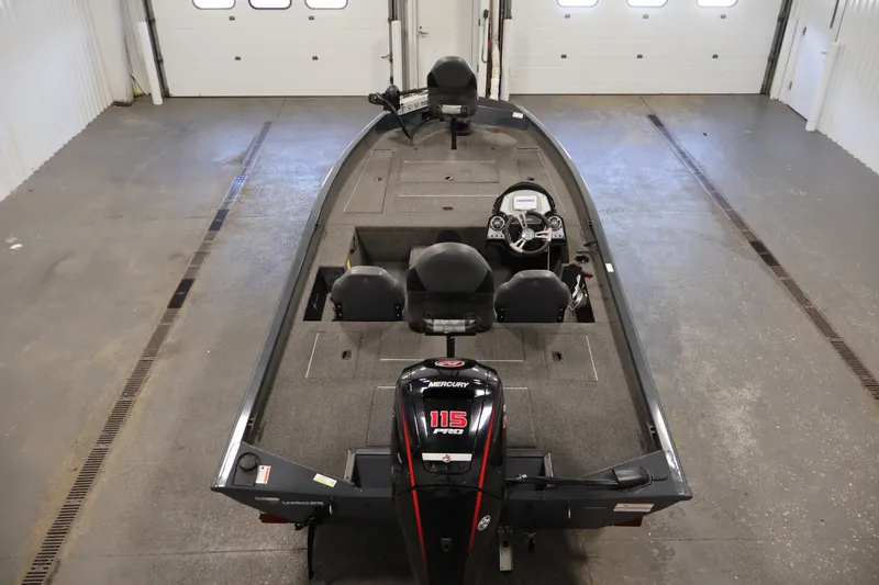Slide: The Image of 2021 Lowe Stinger 195C boat with Mercury 115 Pro XS engine in a garage. - 9