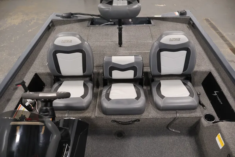 Slide: The Image of 2021 Lowe Stinger 195C boat interior with three gray and white seats. - 26