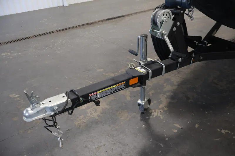 Slide: The Image of Trailer hitch of a 2021 Lowe Stinger 195C boat in a garage setting. - 39