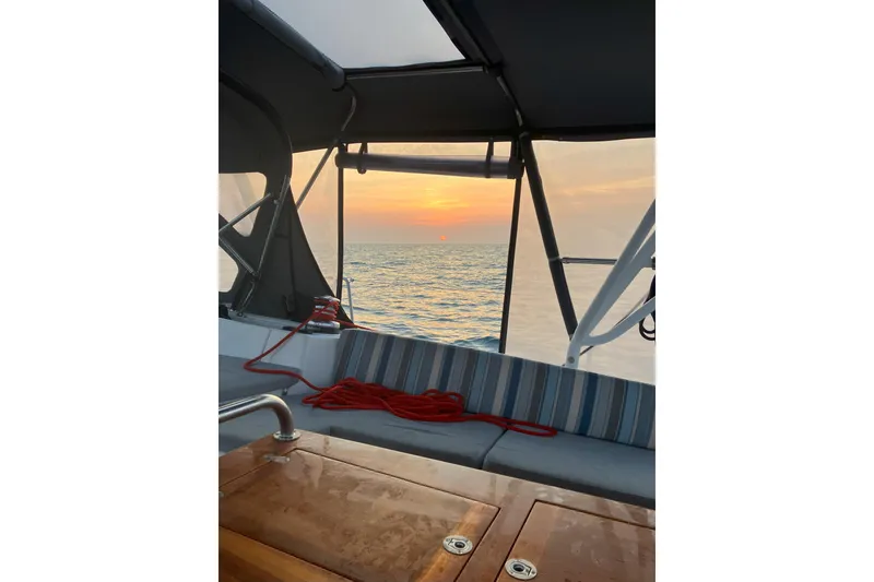 Slide: The Image of Jeanneau 57 sailboat cockpit with ocean sunset view, 2012 model. - 27