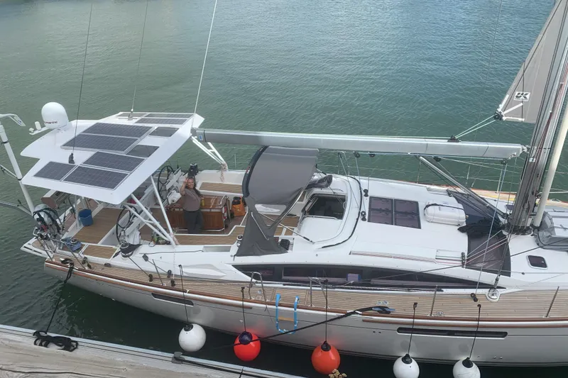 Slide: The Image of 2012 Jeanneau 57 yacht with solar panels docked at marina. - 22
