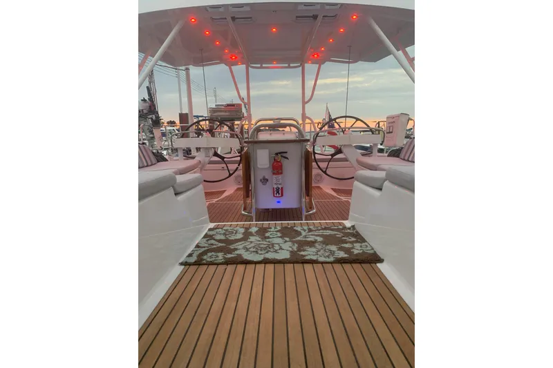 Slide: The Image of Luxurious 2012 Jeanneau 57 yacht interior with elegant seating and ambient lighting. - 19