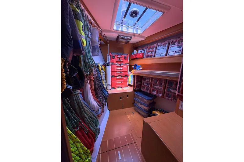Slide: The Image of Organized storage room on 2012 Jeanneau 57 yacht with ropes and toolboxes. - 38
