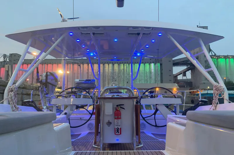 Slide: The Image of Jeanneau 57 yacht cockpit with blue LED lights, 2012 model, docked at industrial port. - 35