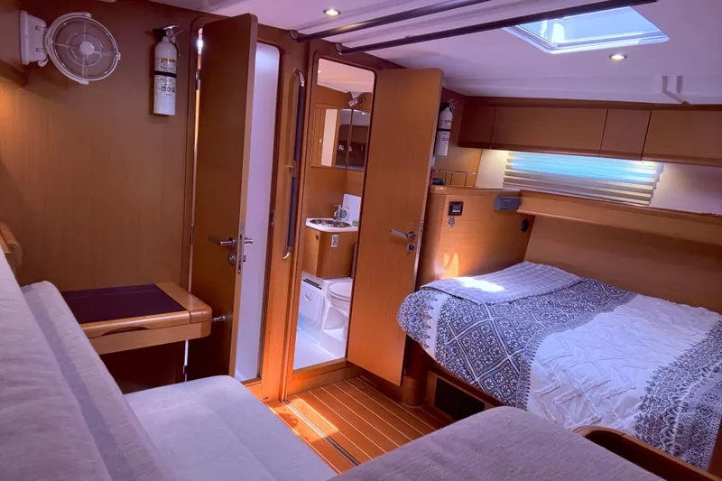 Slide: The Image of Luxurious 2012 Jeanneau 57 yacht interior with cozy bedroom and modern bathroom. - 46