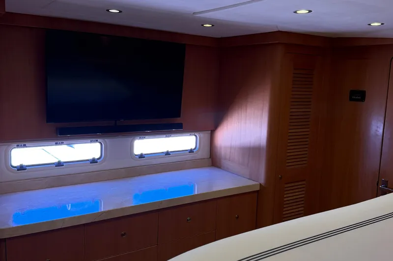 Slide: The Image of Luxurious interior of 2011 Pedigree Cat Sportfish Catamaran with TV and wooden cabinetry. - 61