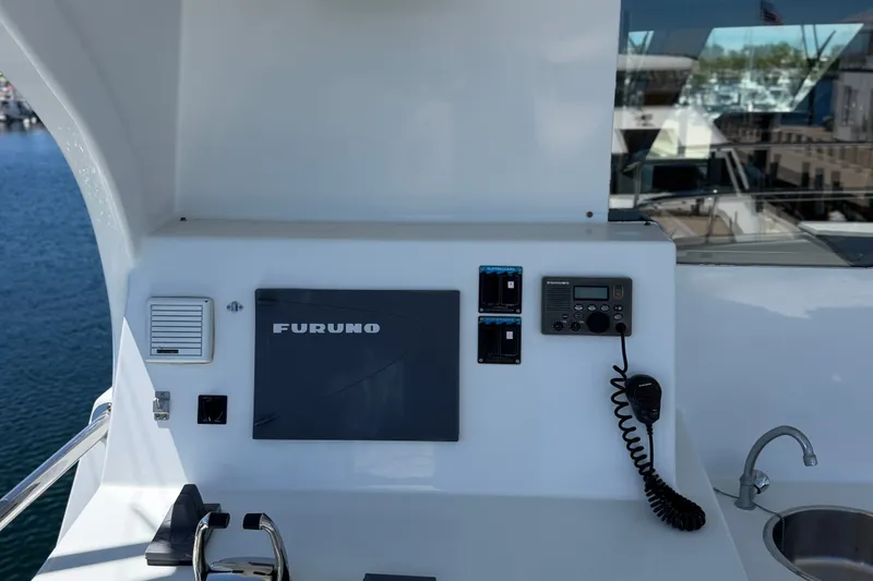 Slide: The Image of Control panel on 2011 Pedigree Cat Sportfish Catamaran with Furuno equipment and ocean view. - 9