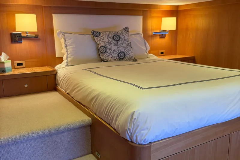 Slide: The Image of Luxurious bedroom interior on 2011 Pedigree Cat Sportfish Catamaran with elegant bedding and warm lighting. - 53