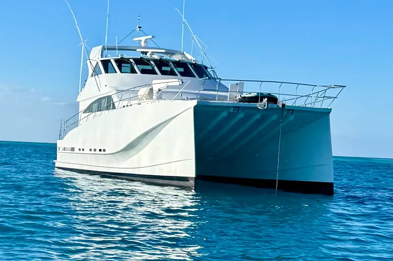 Slide: The Image of 2011 Pedigree Cat Sportfish Catamaran on calm blue ocean waters. - 0