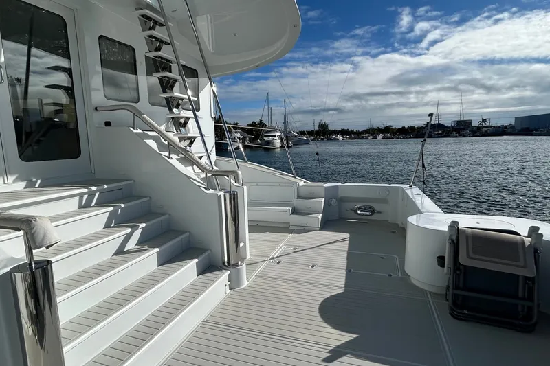 Slide: The Image of Luxurious 2011 Pedigree Cat Sportfish Catamaran deck with stairs, overlooking marina. - 5