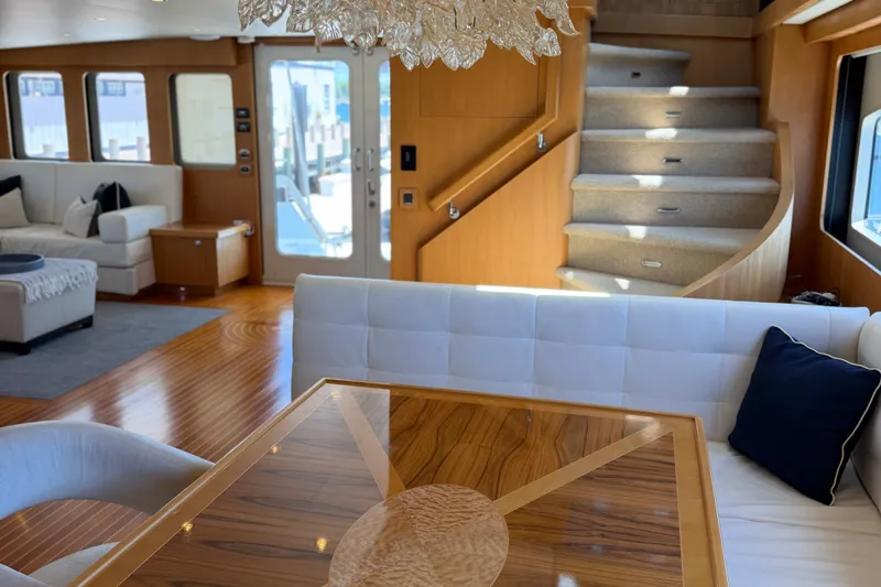 Slide: The Image of Luxurious interior of a 2011 Pedigree Cat Sportfish Catamaran with elegant furnishings and staircase. - 17