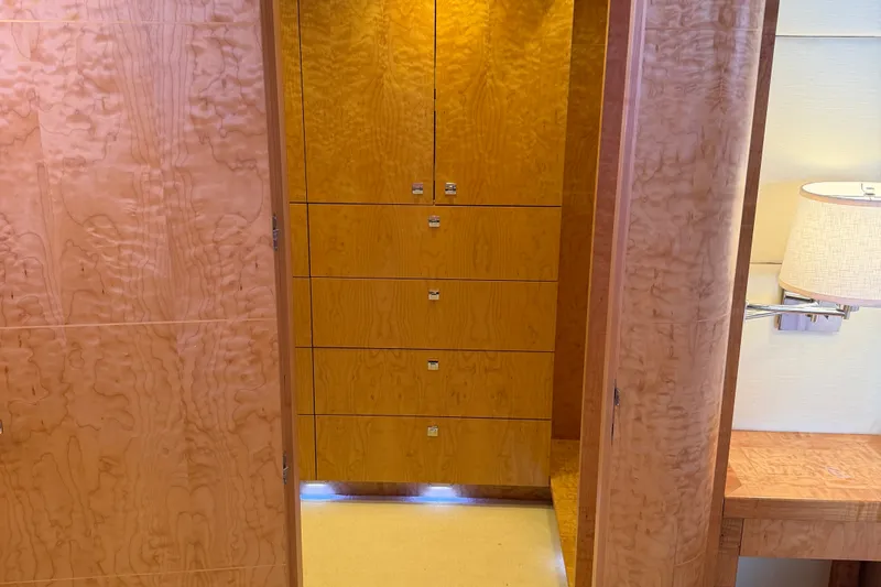 Slide: The Image of Luxurious wooden interior of 2011 Pedigree Cat Sportfish Catamaran, featuring elegant cabinetry and lighting. - 40
