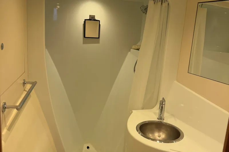 Slide: The Image of Bathroom interior of 2011 Pedigree Cat Sportfish Catamaran, featuring sink and shower area. - 49