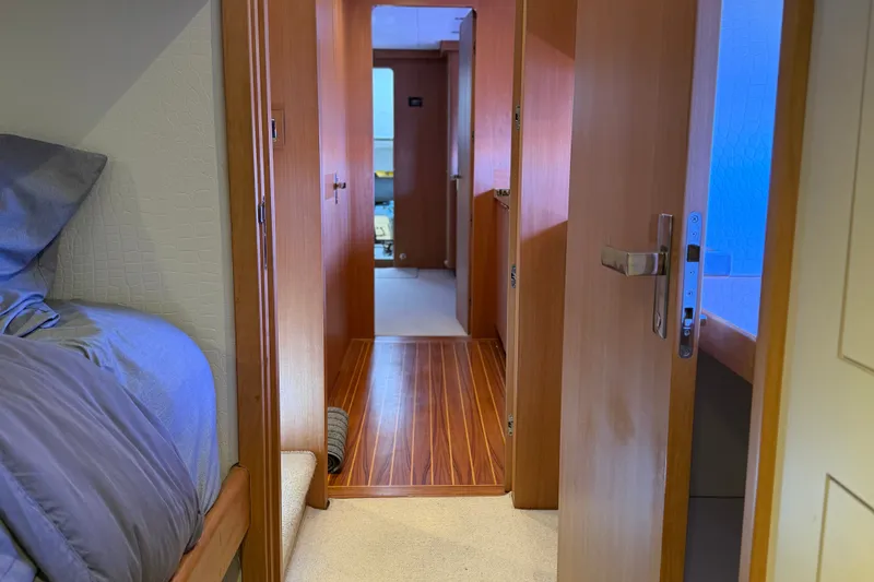 Slide: The Image of Interior of 2011 Pedigree Cat Sportfish Catamaran with wooden flooring and cozy bedroom. - 50
