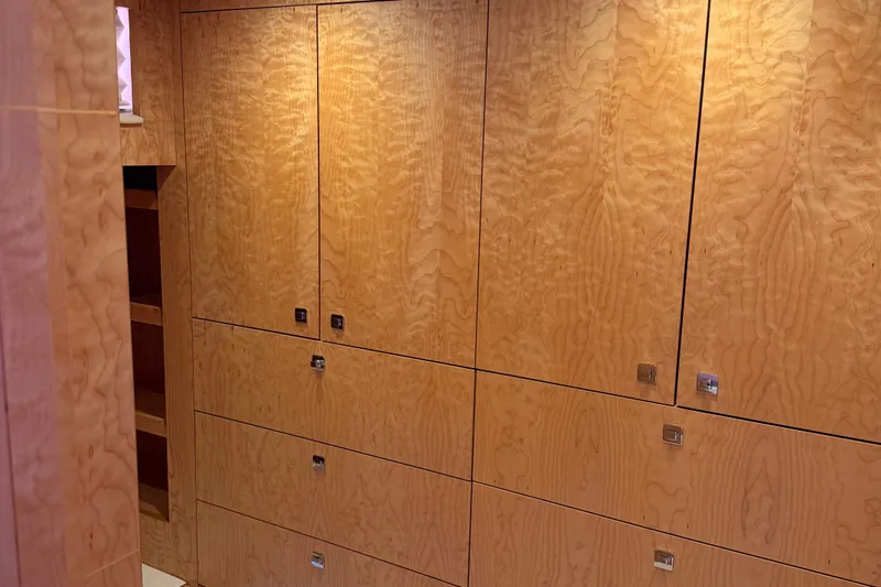 Slide: The Image of Wood-paneled interior of 2011 Pedigree Cat Sportfish Catamaran, featuring sleek cabinetry design. - 42