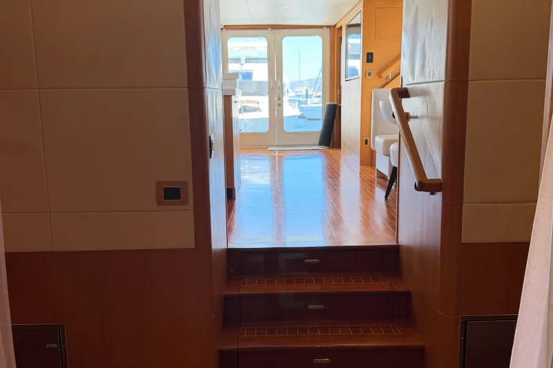 Slide: The Image of Interior view of 2011 Pedigree Cat Sportfish Catamaran with wooden stairs and modern design. - 30