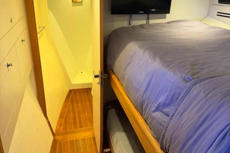 Slide: The Image of Interior of 2011 Pedigree Cat Sportfish Catamaran with cozy bed and wooden flooring. - 47