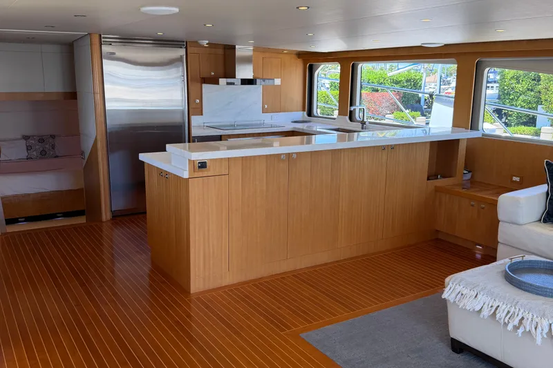 Slide: The Image of Luxurious interior of 2011 Pedigree Cat Sportfish Catamaran with modern kitchen and seating area. - 21