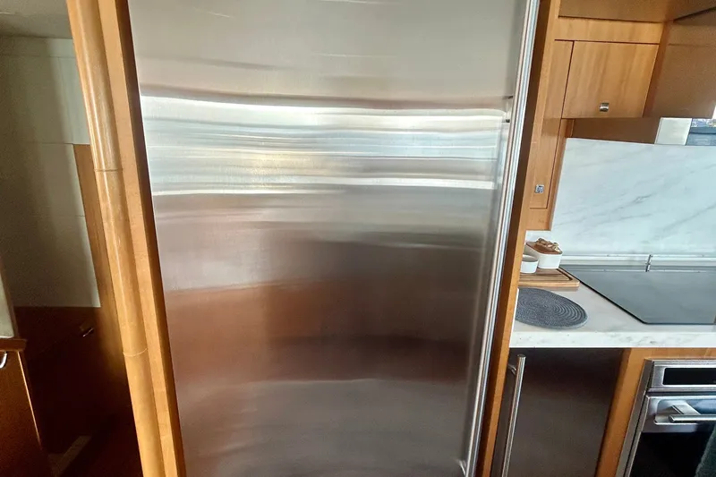 Slide: The Image of Stainless steel refrigerator in 2011 Pedigree Cat Sportfish Catamaran kitchen. - 23