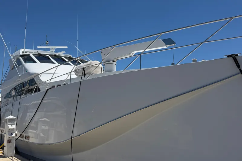 Slide: The Image of 2011 Pedigree Cat Sportfish Catamaran docked under clear blue sky. - 4