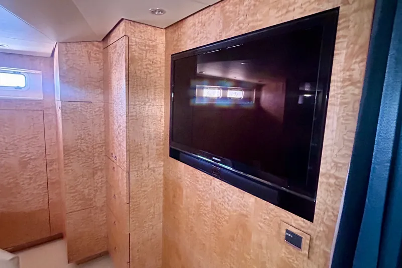 Slide: The Image of Luxurious interior of 2011 Pedigree Cat Sportfish Catamaran with wood paneling and flat-screen TV. - 36
