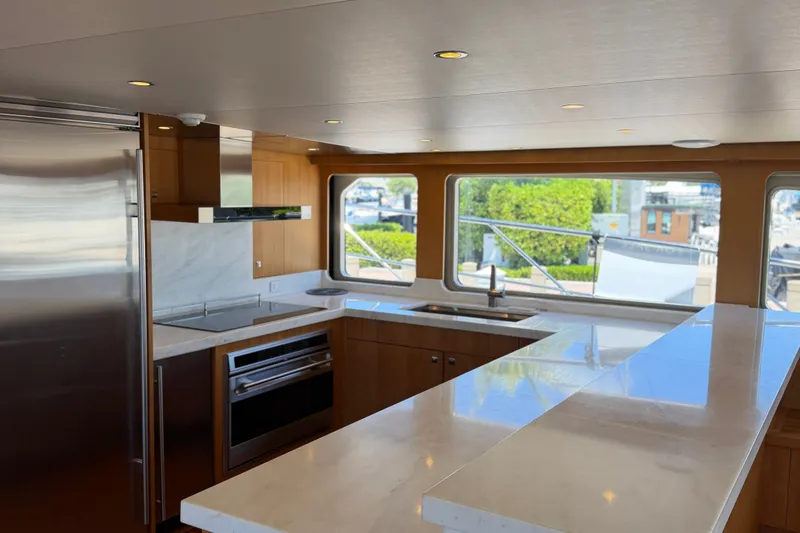 Slide: The Image of Luxurious kitchen interior of 2011 Pedigree Cat Sportfish Catamaran with modern appliances and large windows. - 27