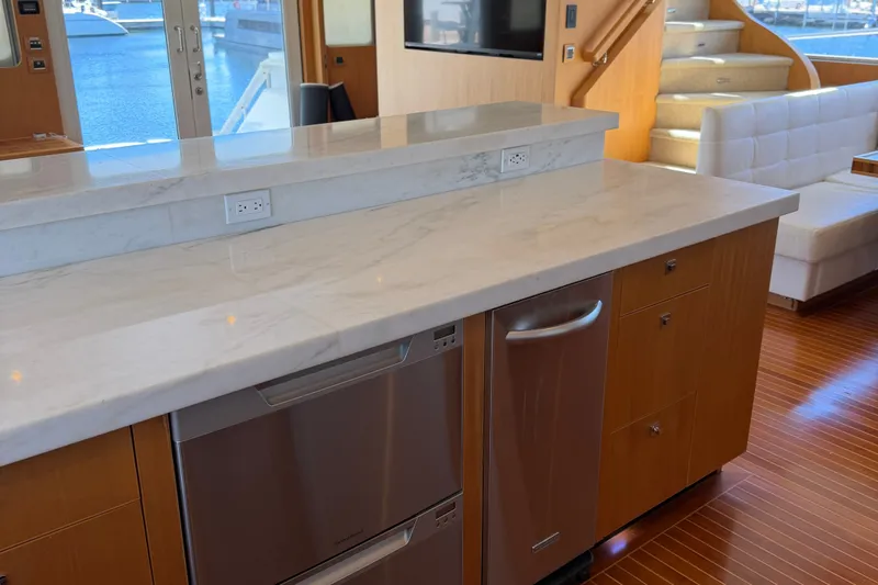 Slide: The Image of Luxurious interior of a 2011 Pedigree Cat Sportfish Catamaran with marble countertop and modern appliances. - 28