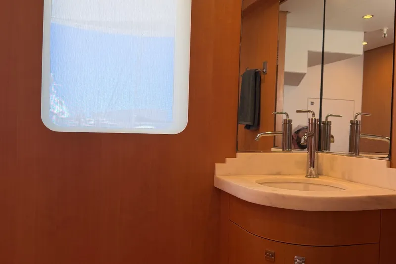 Slide: The Image of Luxurious bathroom interior of 2011 Pedigree Cat Sportfish Catamaran with modern sink and mirror. - 63