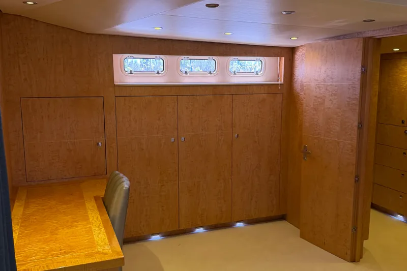 Slide: The Image of Luxurious interior of 2011 Pedigree Cat Sportfish Catamaran with wood paneling and desk. - 34